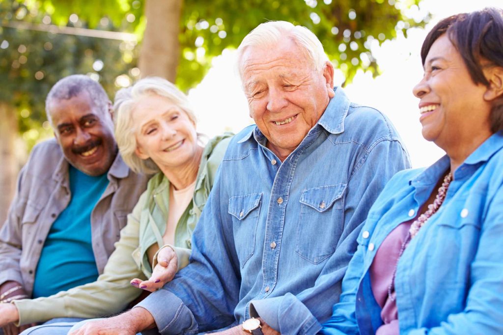 Seniors smiling in assisted living communities